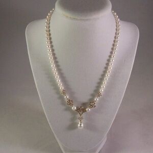 10 karat gold, diamond, and beautiful pearls necklace
